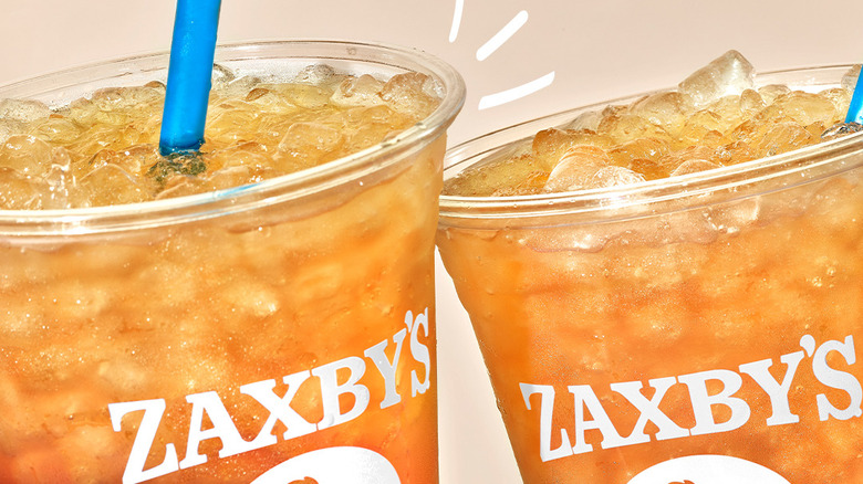 Two Zaxby's sweet teas clinking