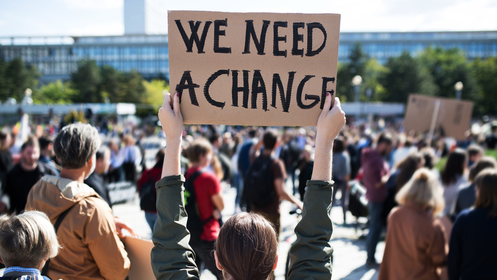 person holding a sign