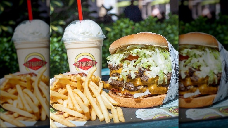 Fatburger XXXL Triple Kingburger with drink and fries outside.