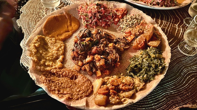 Plate with injera and various Ethiopian foods