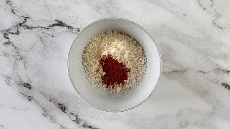 Parmesan and paprika in bowl