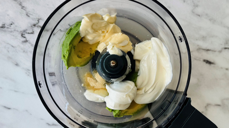 Avocado lime dip ingredients in food processor