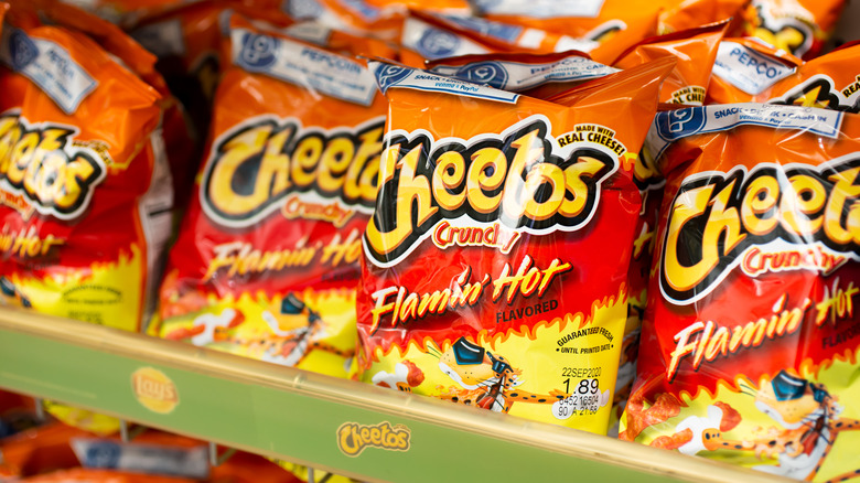 bags of flamin hot cheetos on shelf