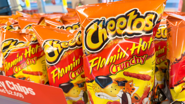 Bags of Flamin' Hot Cheetos on a shelf