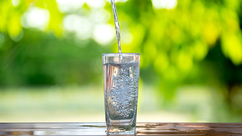 water flowing into glass