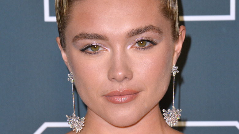 Florence Pugh wearing earrings