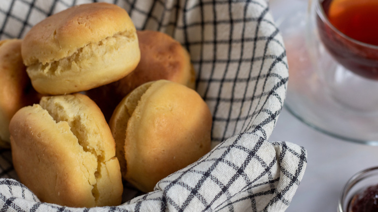 sourdough biscuits in towel-lined basket