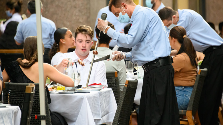 People dining at Fogo de Chão in 2020