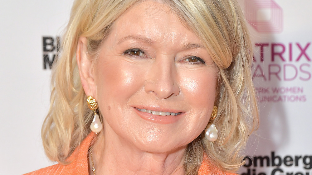 Martha Stewart smiling in orange coat