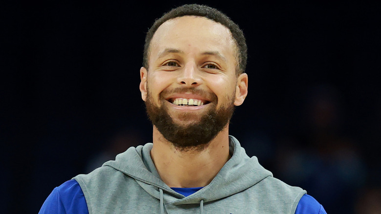 Stephen Curry smiling before an NBA game