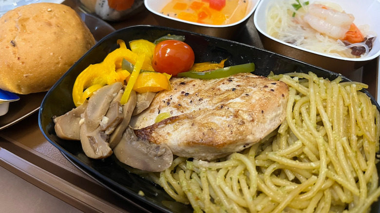 In-flight meal of pasta, chicken, and vegetables