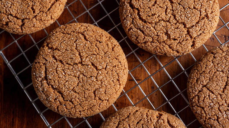 Molasses cookies on a wire baking rack