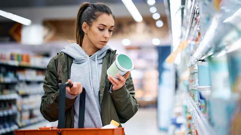 woman looking at food in market