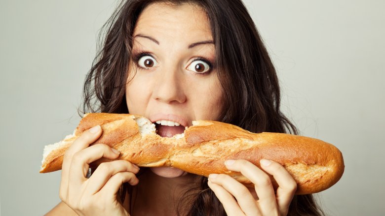 woman eating bread