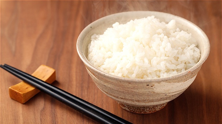 bowl of rice with chopsticks 