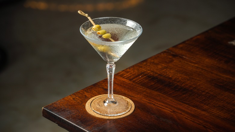 martini on dark wooden table