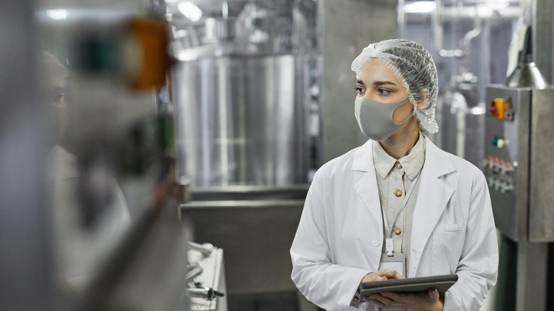 Woman in a food factory