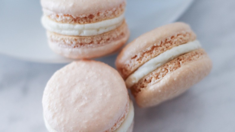 three caramel macarons