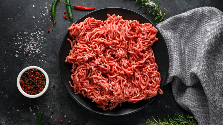 raw ground meat in a skillet