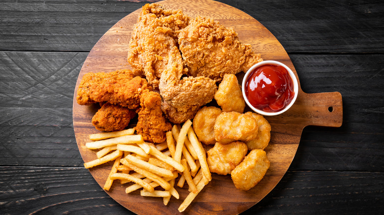 French fries with fried chicken and chicken nuggets