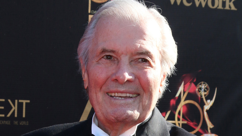 Jacques Pépin smiling at red carpet event.