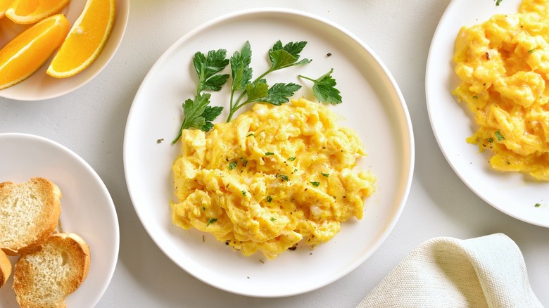 scrambled eggs on plate with garnish