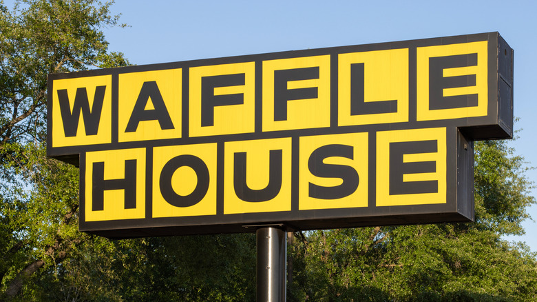 The Waffle House logo on a large, exterior sign from the chain restaurant's Humble, Texas, location.