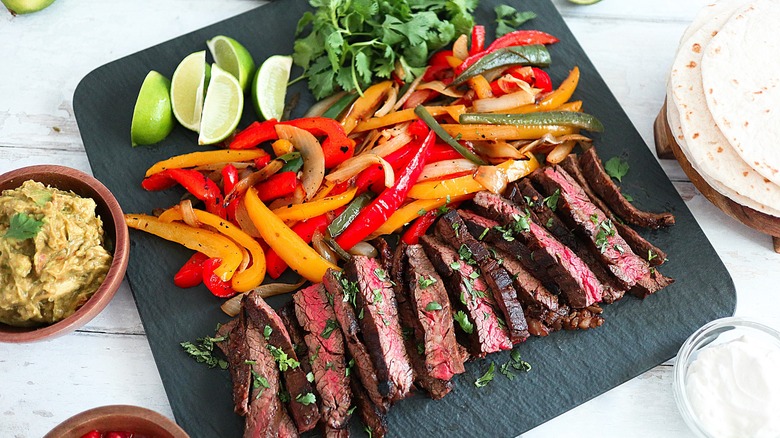 Cooked fajita ingredients on board