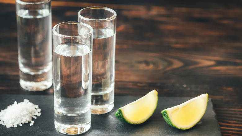 Glasses of tequila with lime and salt
