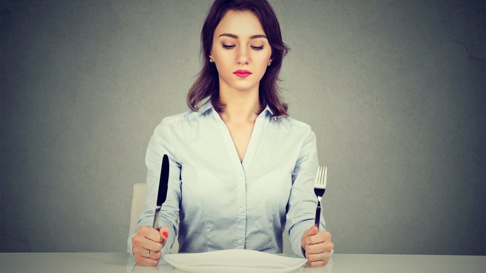 Woman with empty plate