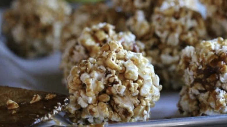 Tac-tac popcorn balls on baking sheet