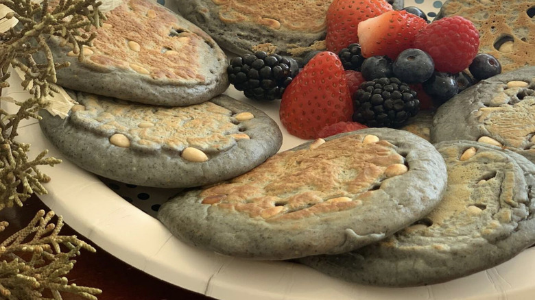 Pine nut cakes and fresh fruit on plate