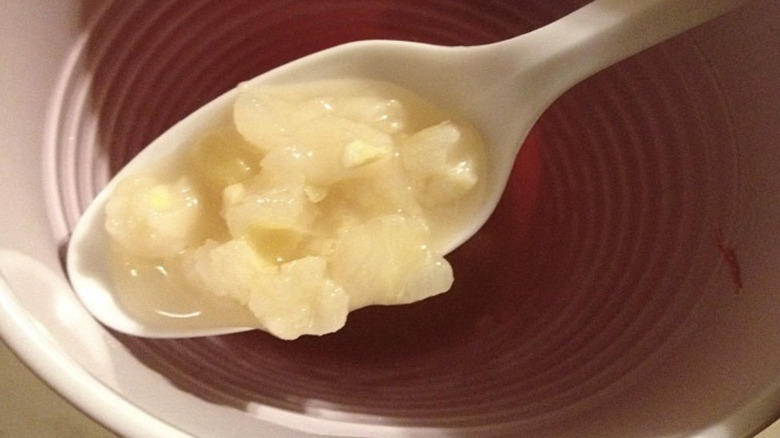 Plastic spoon with corn porridge
