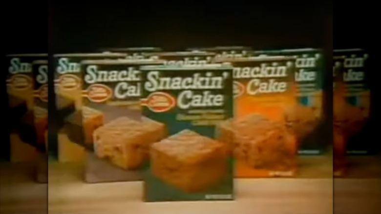 Boxes of Betty Crocker Snackin' Cake staged in commercial from 1970s
