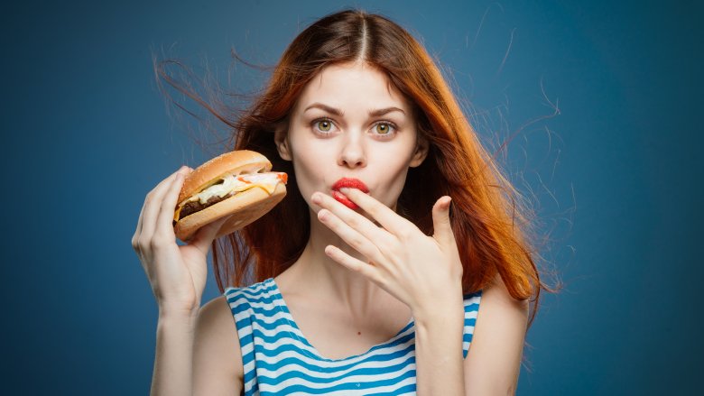 woman eating burger