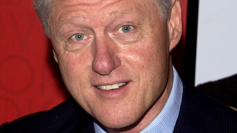 Former president Bill Clinton smiling at event