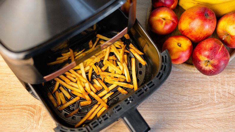 French fries in an open air fryer.