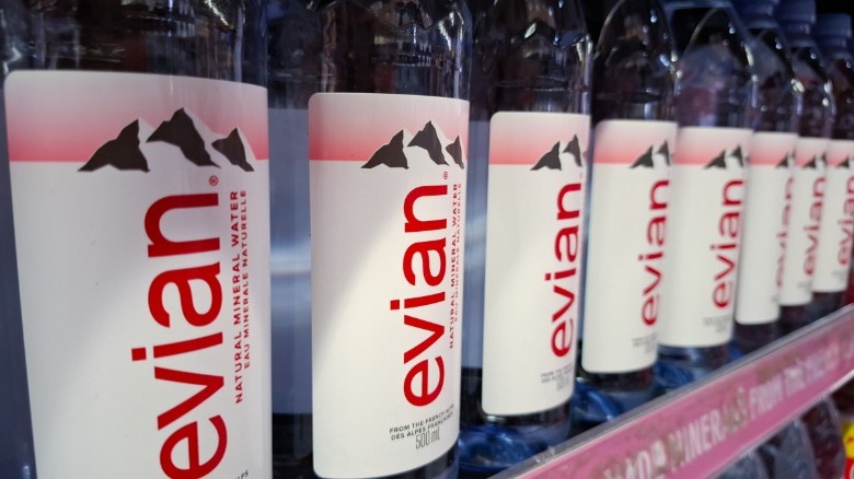 Evian water bottles on a shelf