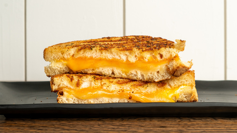 A sliced grilled cheese sandwich