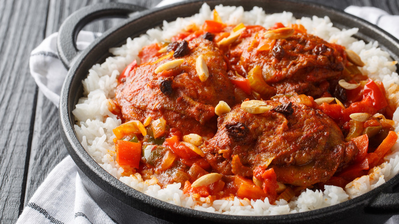 Country Captain chicken dish served over rice in a pan