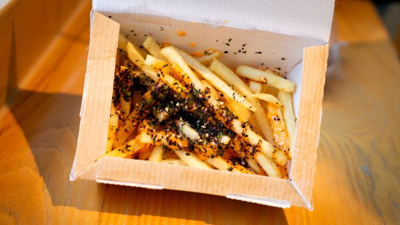 French fries with furikake seasoning in box