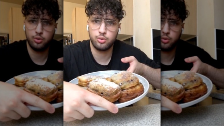 person showing off fried cake 