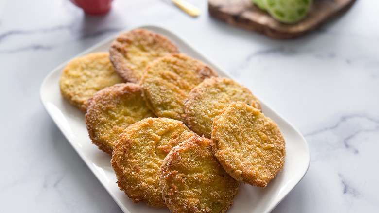 fried tomatoes on white plate