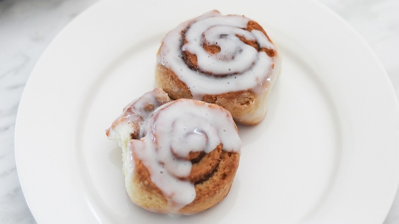 two cinnamon rolls on plate