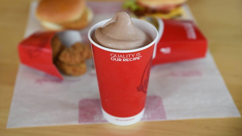 Wendy's Frosty in front of a meal