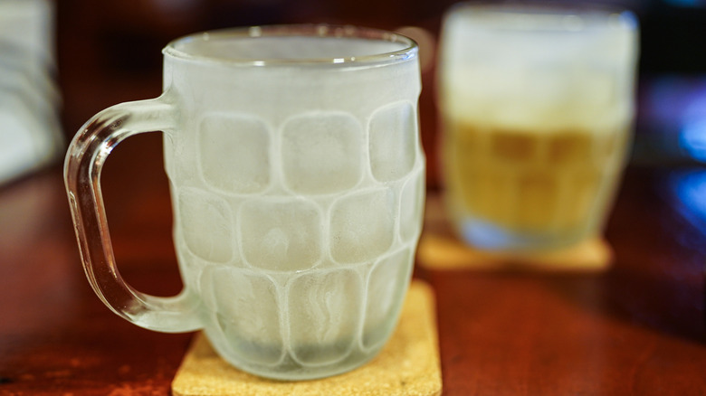 Frosted beer mug on coaster