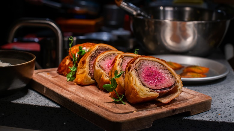 beef Wellington on cutting board