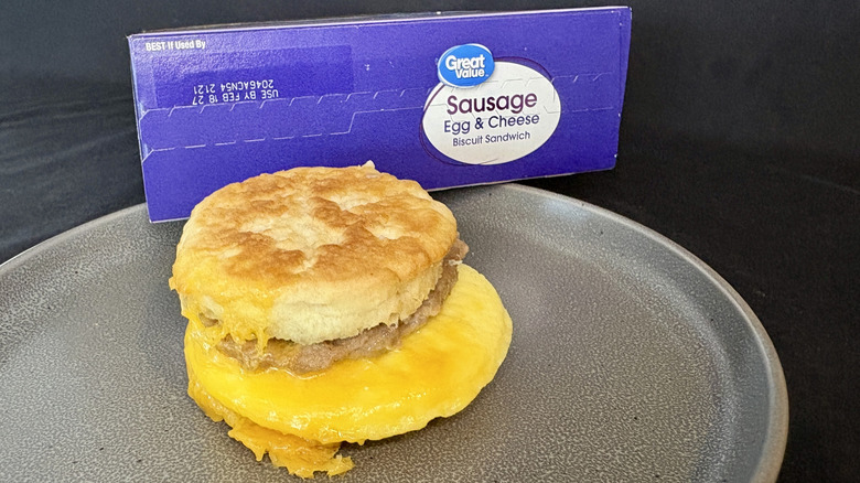 breakfast sandwich on plate in front of purple box