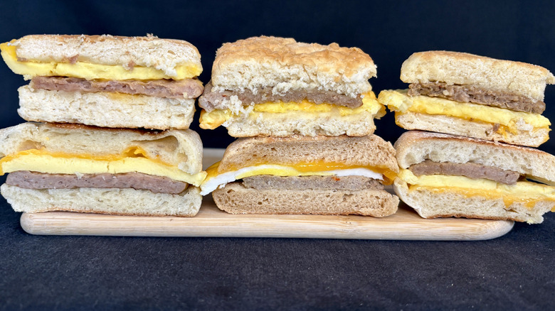 variety of frozen breakfast sandwiches cut in half and stacked