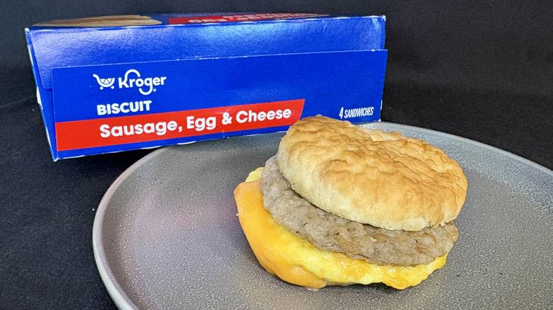breakfast sandwich on plate in front of blue box